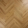 Brushed oak flooring with herringbone pattern and natural wood grain texture