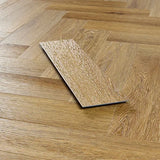 Brushed oak wood flooring sample on herringbone pattern floor, close-up view
