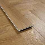 Brushed oak flooring plank close-up on wood floor with herringbone pattern