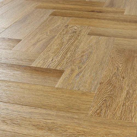 Brushed oak engineered wood flooring in herringbone pattern, close-up angle