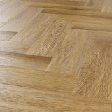Brushed oak engineered wood flooring in herringbone pattern, close-up angle