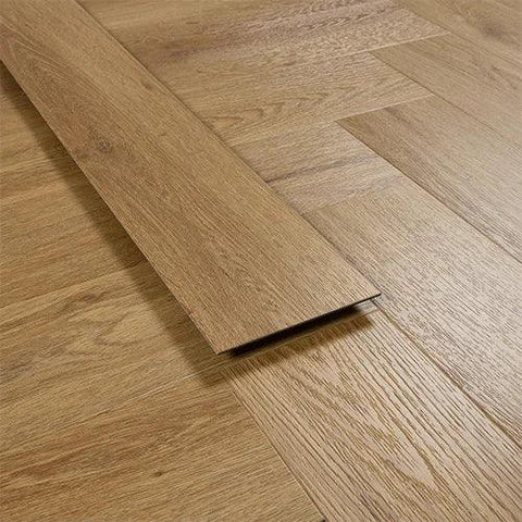 Brushed oak wood flooring plank showing grain detail and herringbone installation pattern