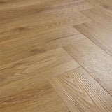 Brushed oak wood flooring in herringbone pattern with natural grain texture
