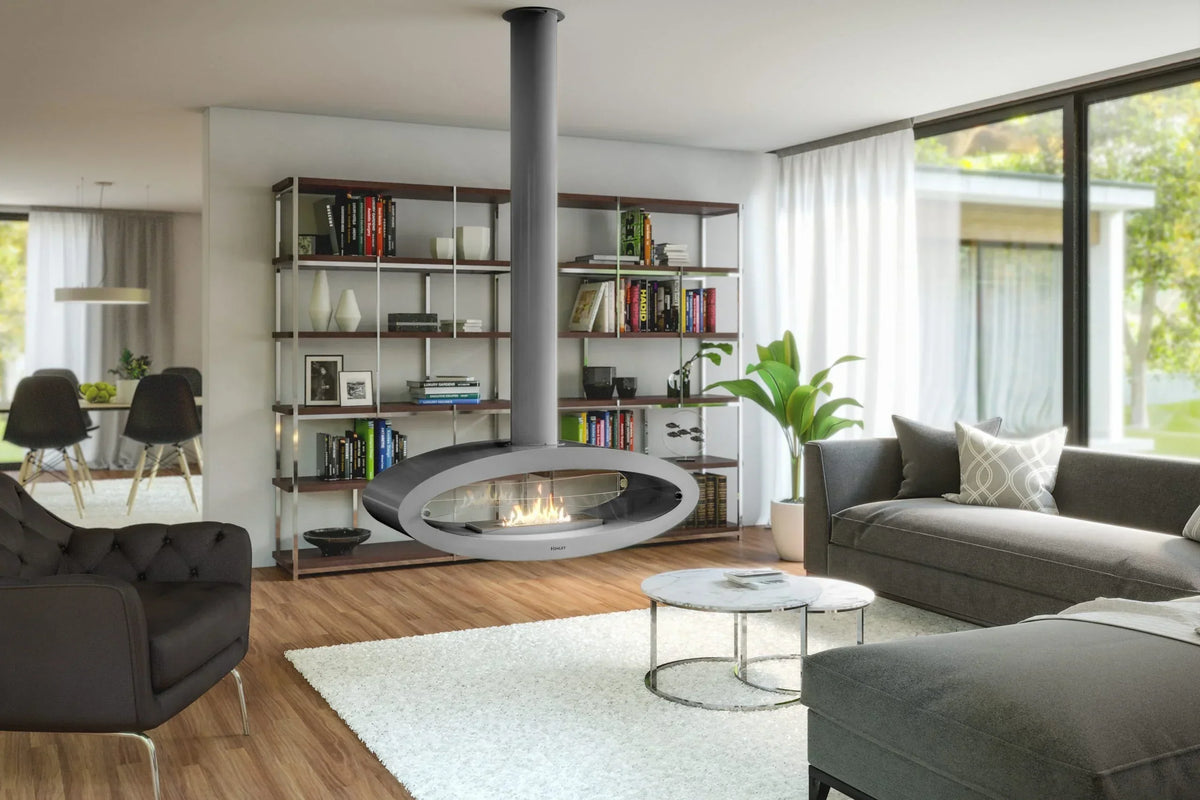 Modern living room with grey sofa, suspended fireplace, bookshelf, and round coffee table