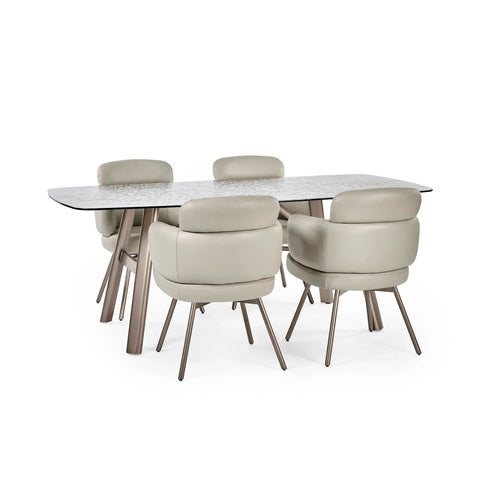 Rectangular dining table with textured glass top and four beige upholstered chairs