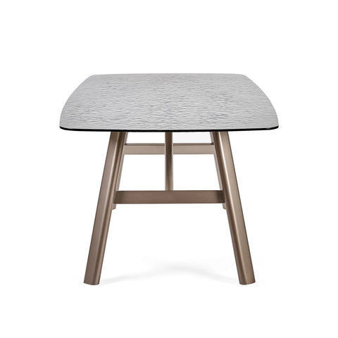 Rectangular dining table with textured light grey top and bronze metal legs, front view