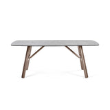 Rectangular glass dining table with metal legs and textured tabletop, front view