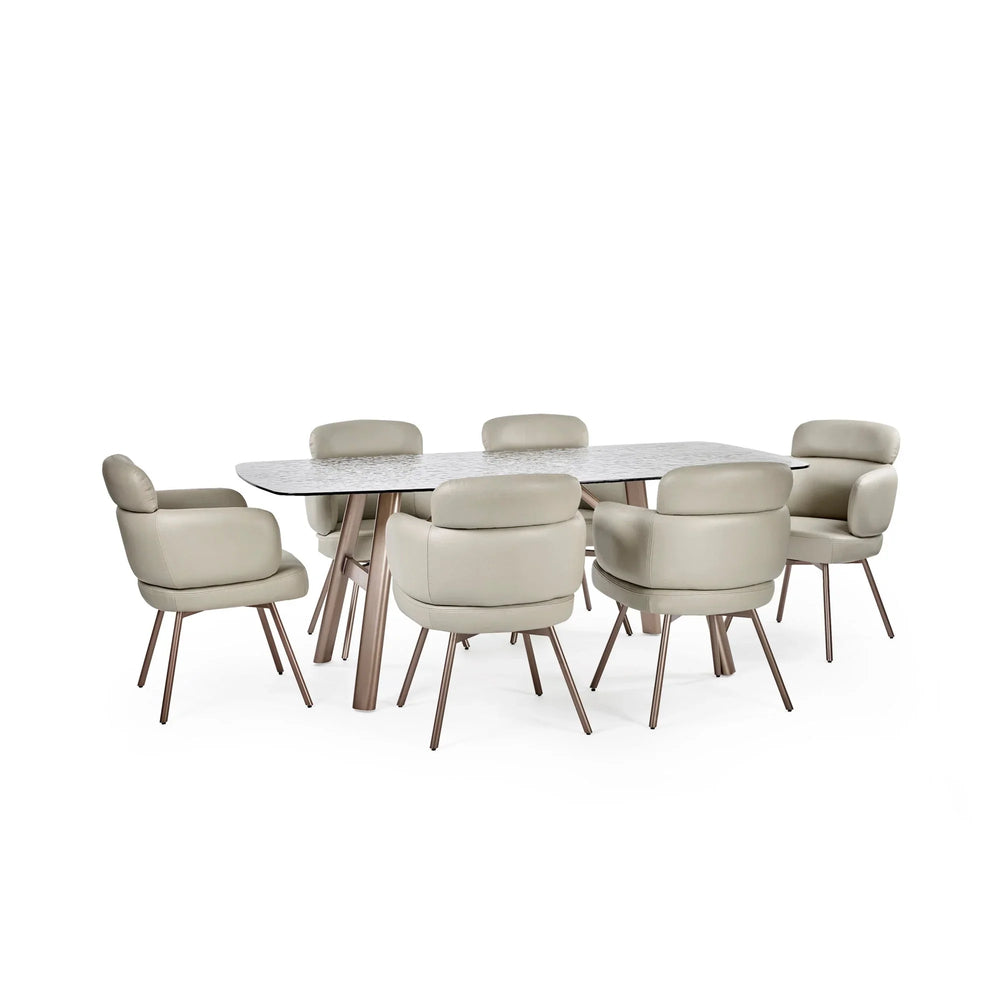 Modern dining table with marble top and six beige upholstered chairs