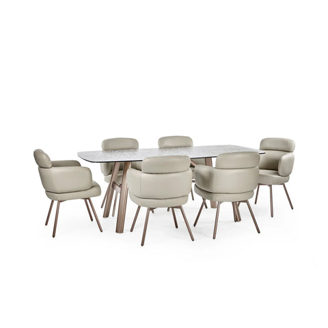 Modern dining table with marble top and six beige upholstered chairs