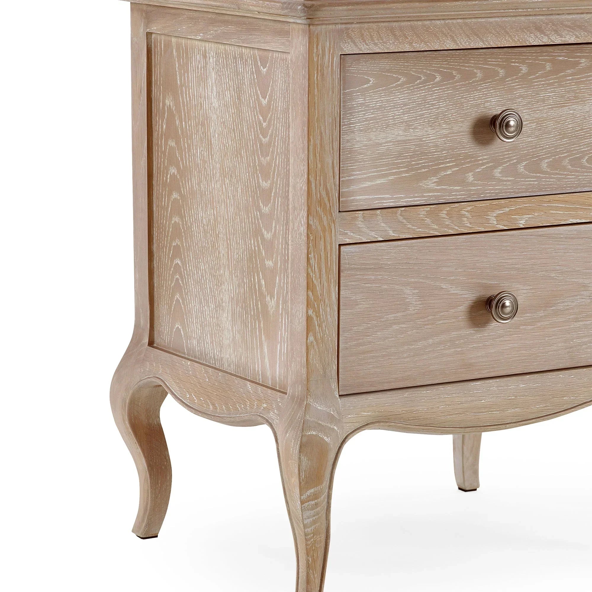 Oak bedside table with two drawers and curved legs, close-up of wood grain finish