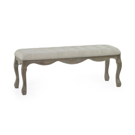 Tufted beige fabric bench with wavy carved natural wooden frame and cabriole legs on white background