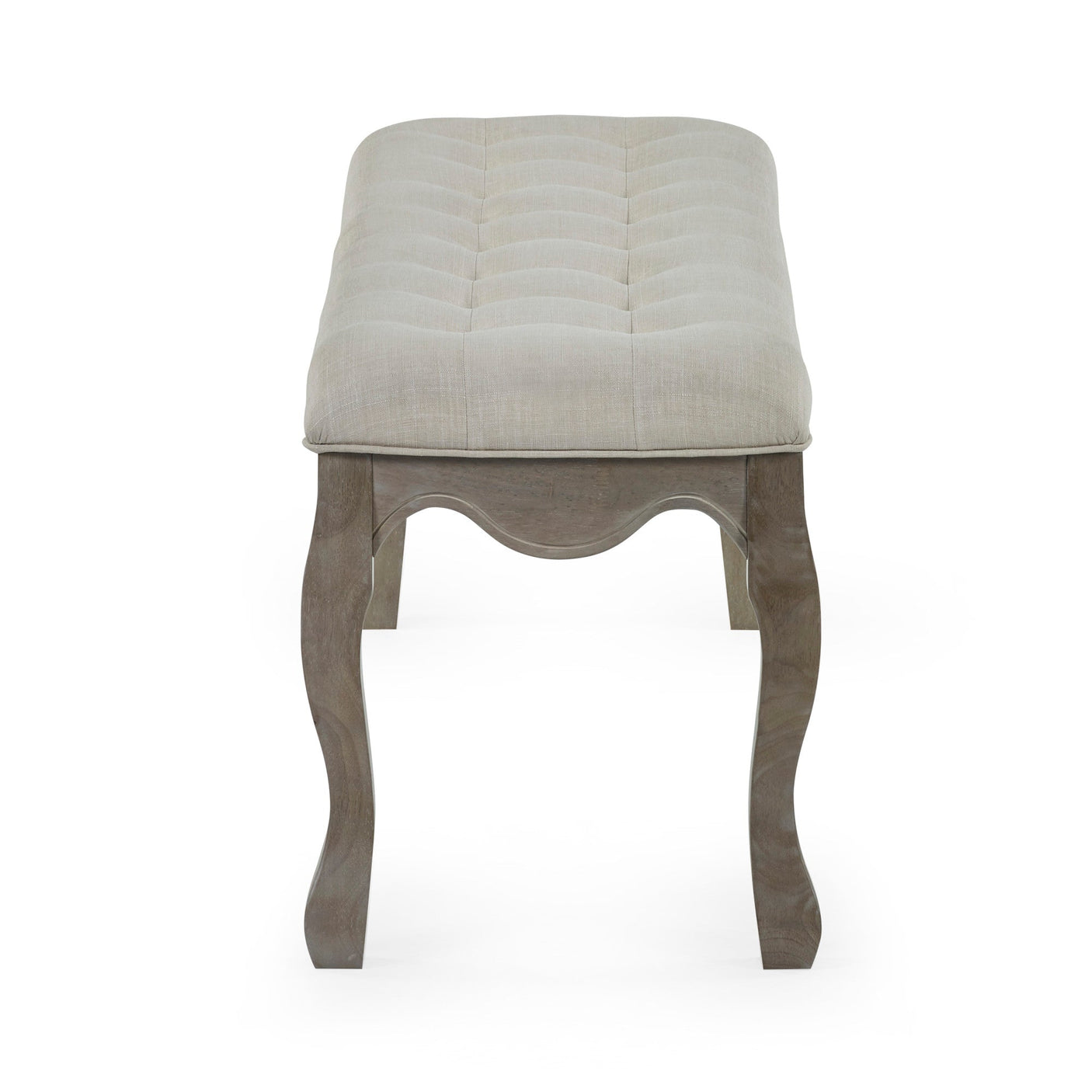 Side view of button tufted beige fabric bench with curved natural wood legs on white background