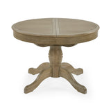 Round extending wooden table with light brown finish on white background, pedestal base with curved feet