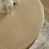 Close-up of light brown wooden round table edge showing grain and smooth finish