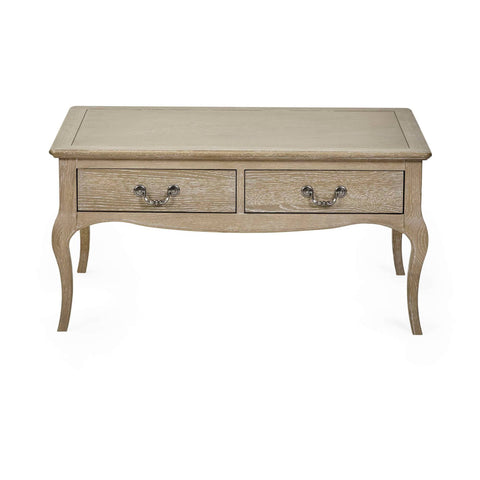The Camille French Style Rectangular Coffee Table features a limed oak finish with elegant curved legs and two decorative drawers, perfect for adding a touch of sophistication to any living room setting