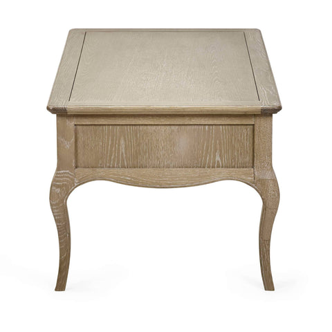 The Camille French Style Rectangular Coffee Table features a limed oak finish with elegant curved legs and a smooth top, perfect for adding a touch of sophistication to any living room setting
