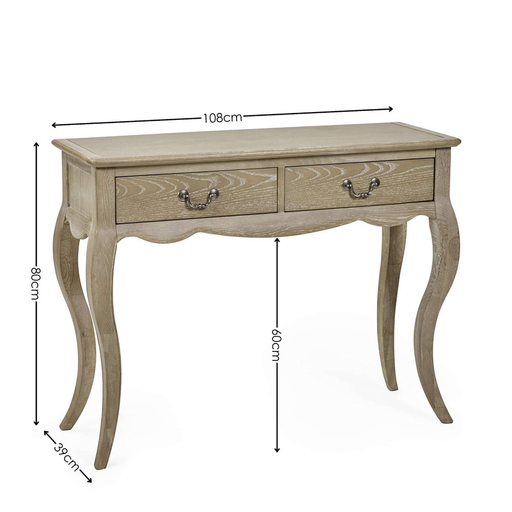 The Camille Console Table features a limed oak finish with elegant curved legs and two drawers, perfect for adding a touch of sophistication to any entryway or living space