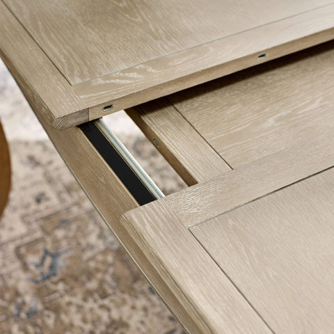 Close-up detail of the Camille French Style Rectangular Extending Dining Table in limed oak, showcasing the smooth finish and extension mechanism