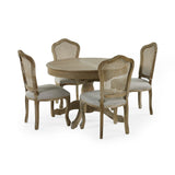 Four Camille rattan dining chairs around round table with central pedestal, light grey cushioned seats