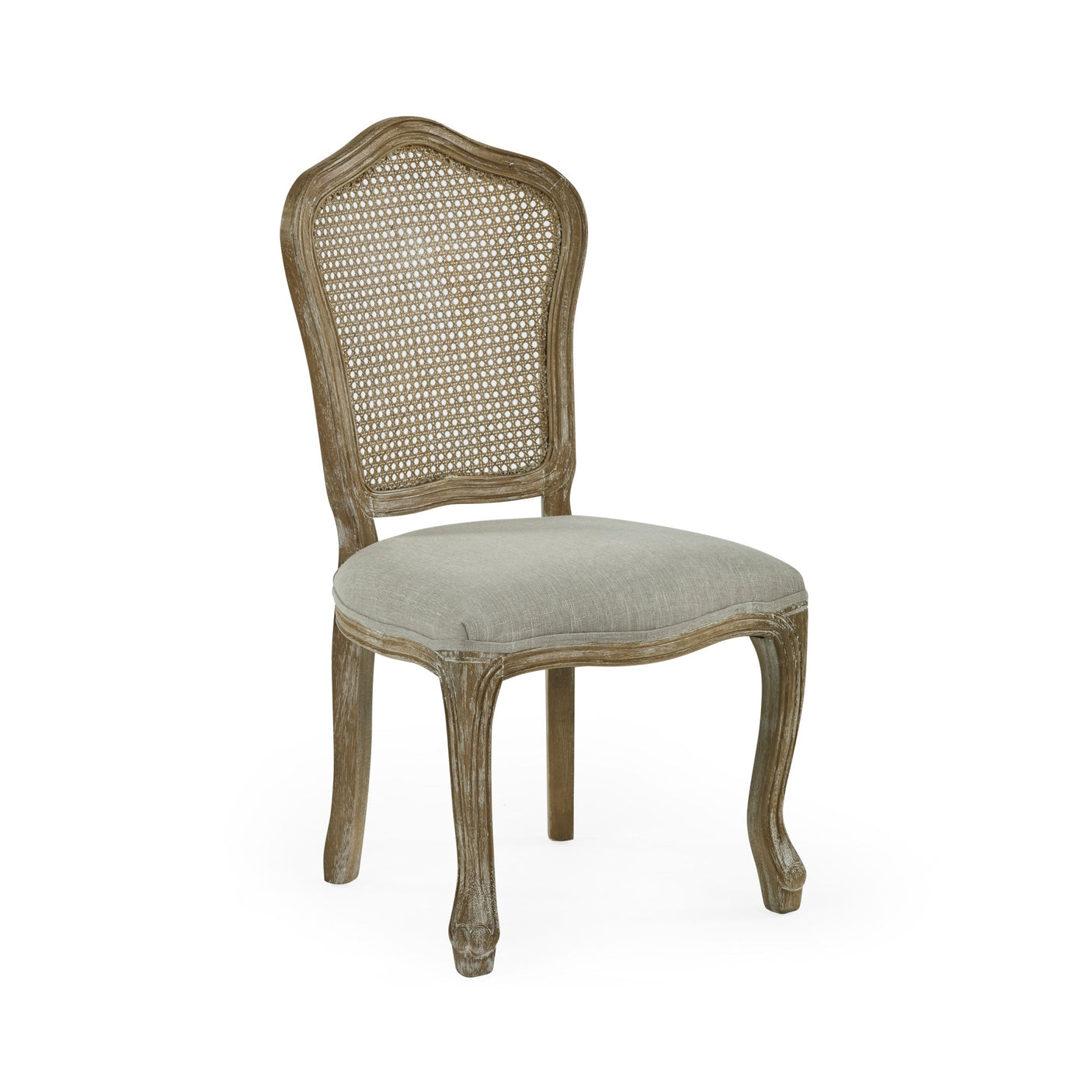 Beige upholstered rattan dining chair with carved light wood frame angled to show front and side on white background