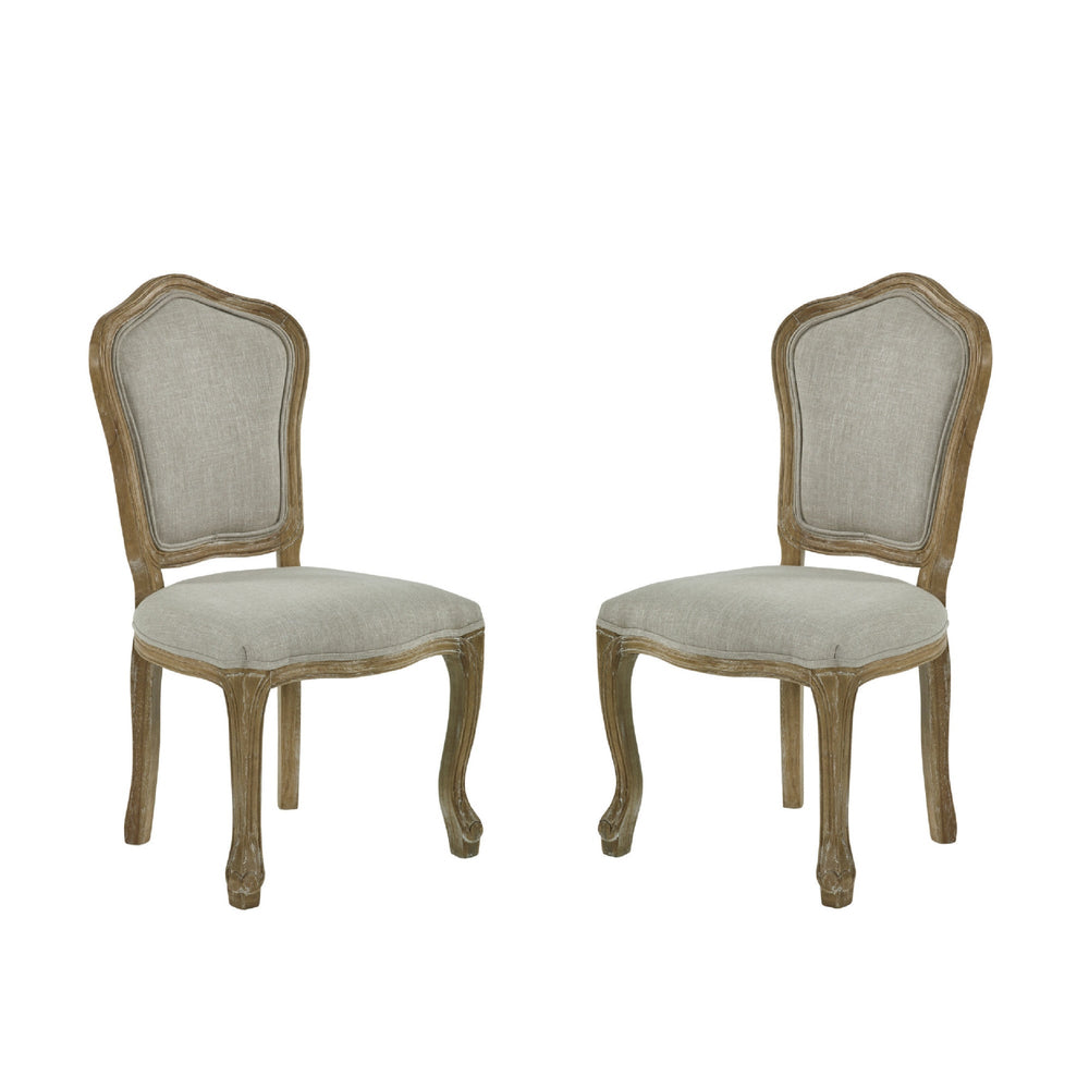 Pair of beige upholstered dining chairs shown front facing on white background