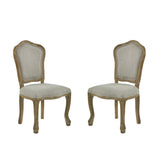 Pair of beige upholstered dining chairs shown front facing on white background