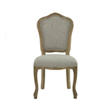 Front view of beige upholstered dining chair with curved weathered wood frame and legs