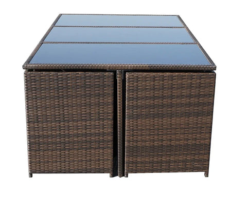 Brown rattan outdoor dining table with glass top panels, front view