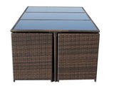 Brown rattan outdoor dining table with glass top panels, front view