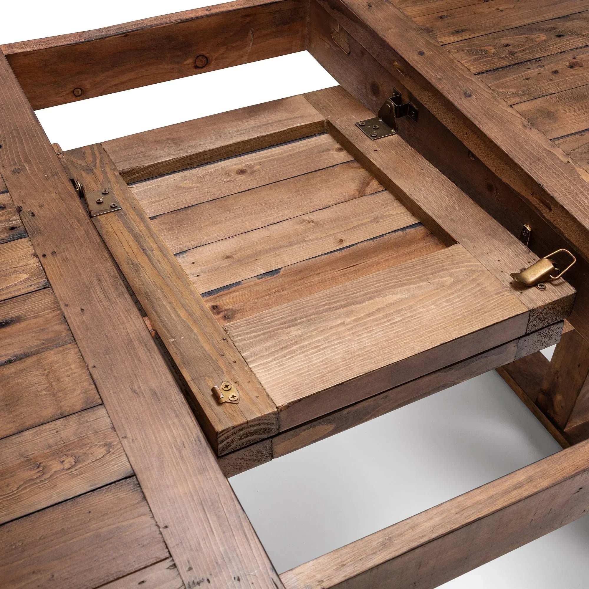 Reclaimed wood extending dining table with metal hinges and leaf extension mechanism detail