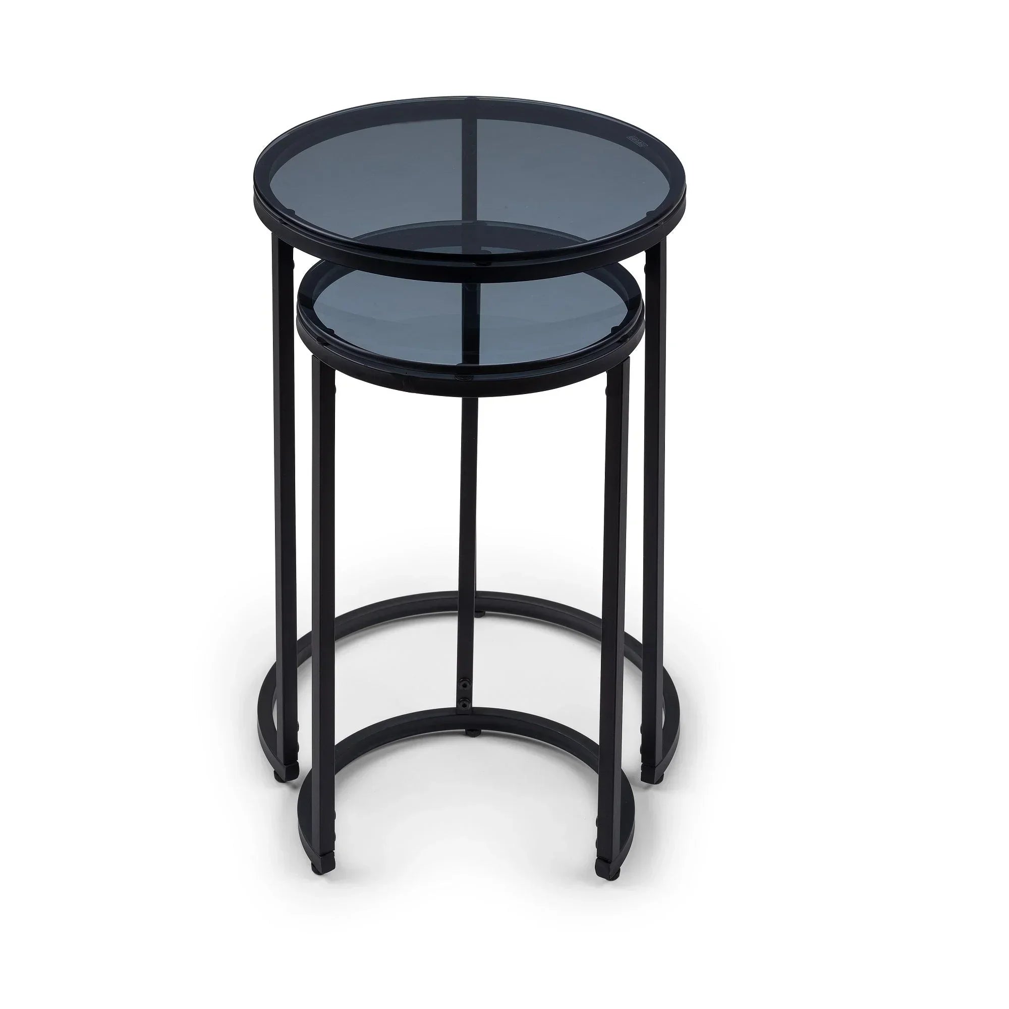 Black metal round nesting side tables with glass tops on white background