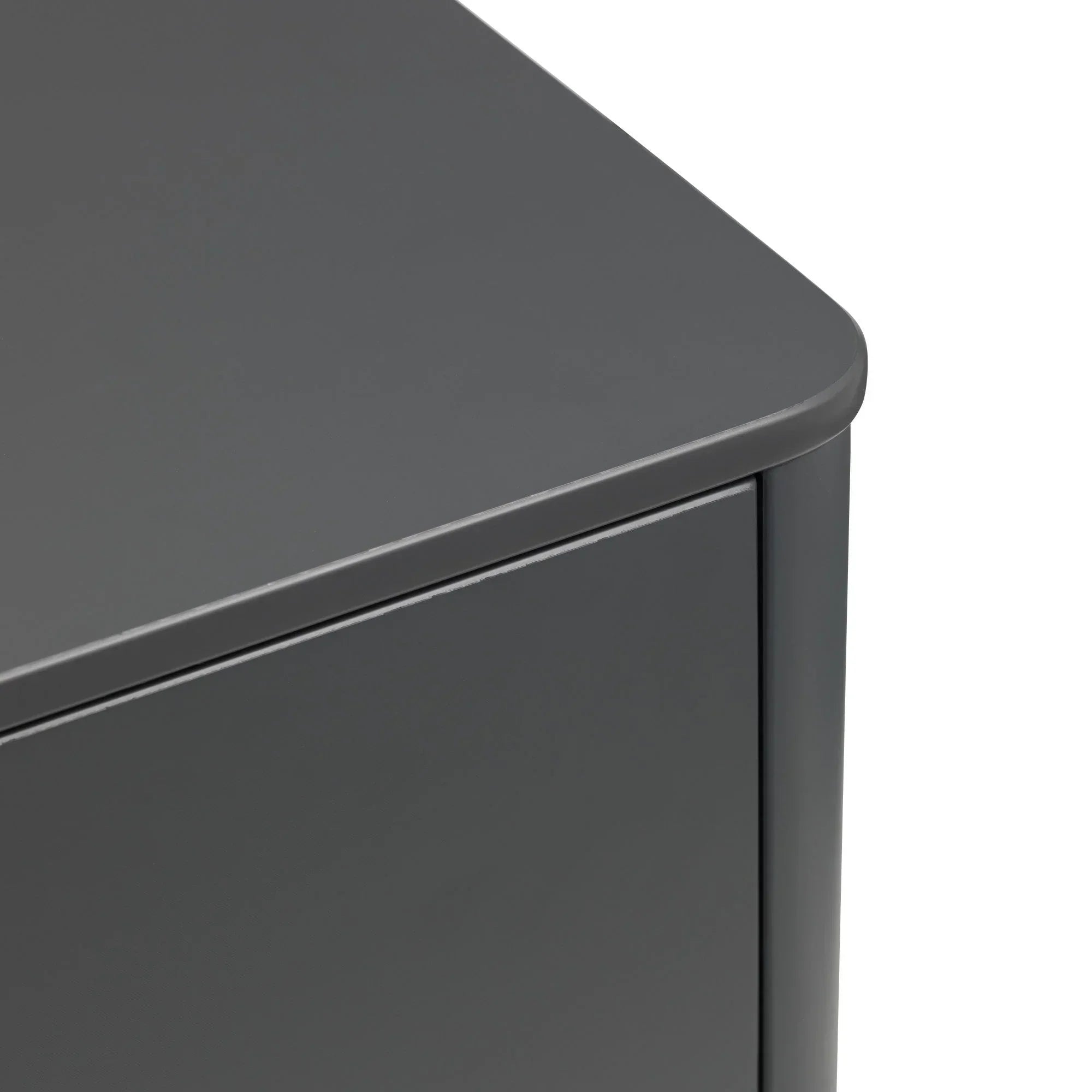 Closeup of grey cabinet corner with smooth matte finish and curved edge detail