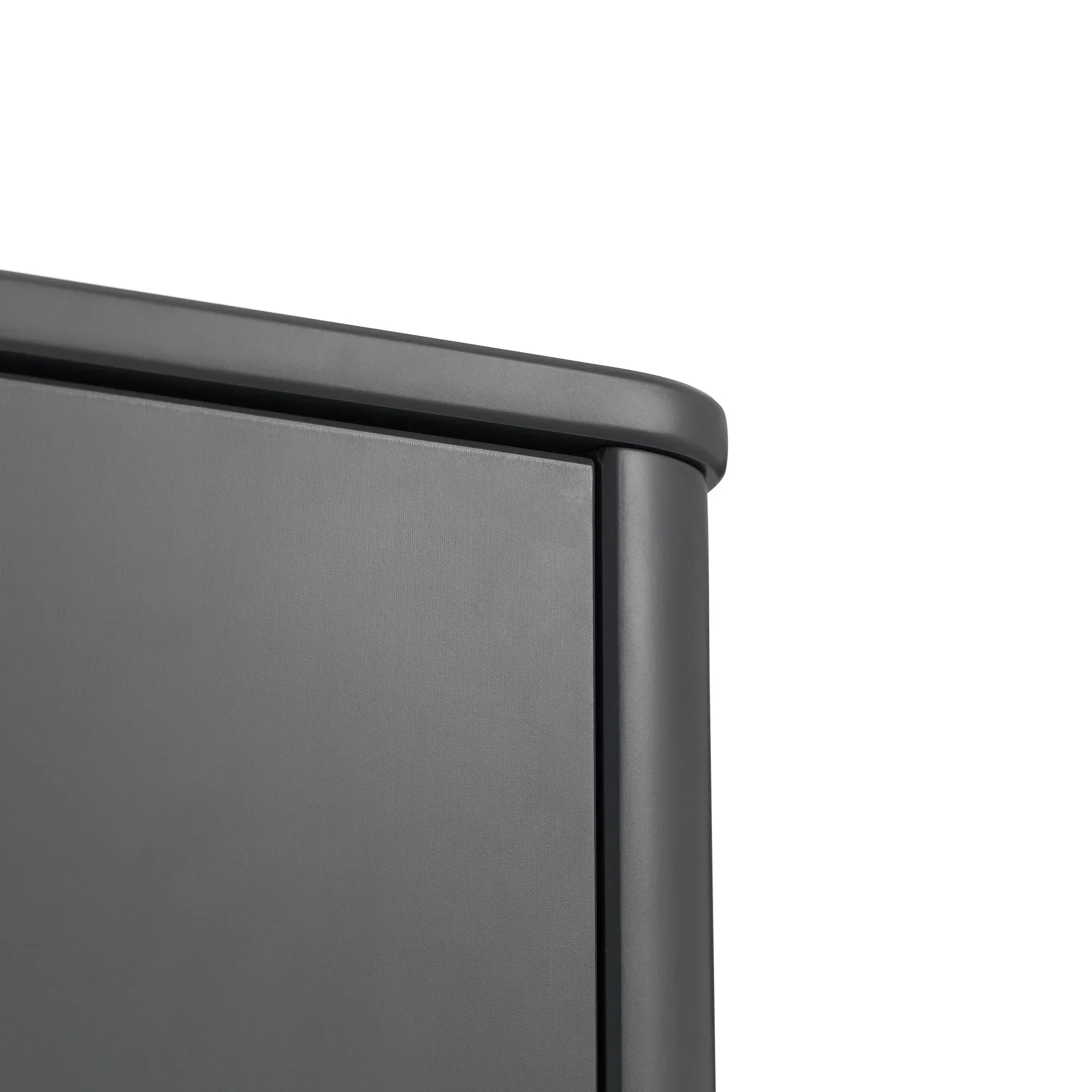 Close-up of matte black cabinet corner with smooth rounded edge detail