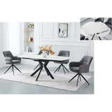 A modern dining set featuring a rectangular white table with a black X-shaped base and four gray upholstered swivel chairs, shown in a bright white dining room with a light rug. An inset image in the top right shows a close-up of the white oval-shaped seat cushion.