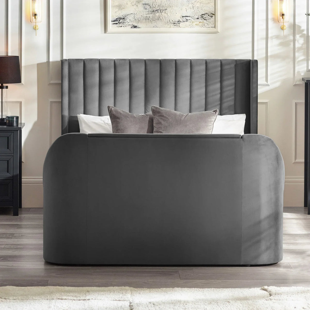 Grey upholstered bed frame with vertical panel headboard and matching pillows in modern bedroom