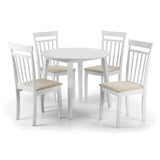 Round white dining table surrounded by four white wooden chairs with beige cushions.