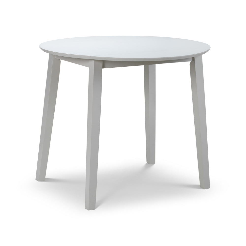Round white wooden table with all dropleaf sections unfolded