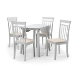 White round Coast dropleaf table with leaf dropped surrounded by four white wood chairs with cream cushions