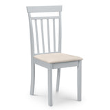 Light grey wooden dining chair with vertical slatted back and cream cushioned seat, isolated