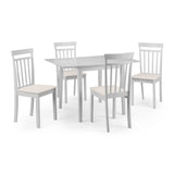 Set of four white dining chairs with beige seats arranged around pale rectangular dining table on white background.