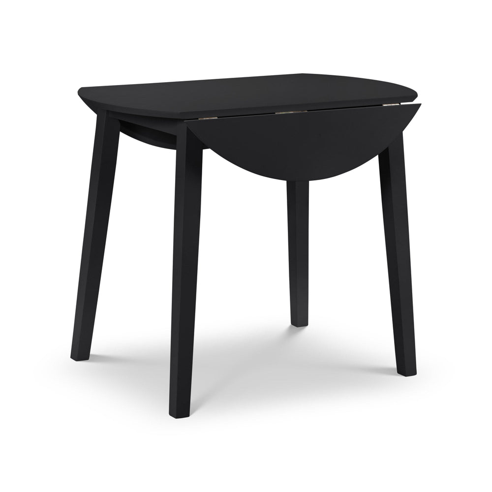 Black wooden drop-leaf table with one half of the top leaf folded down, angled view