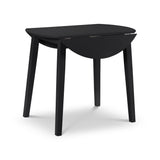 Black wooden drop-leaf table with one half of the top leaf folded down, angled view