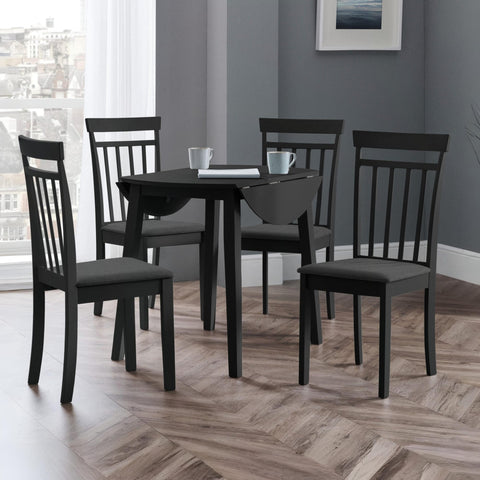 Round black wooden table with all dropleaf sections unfolded