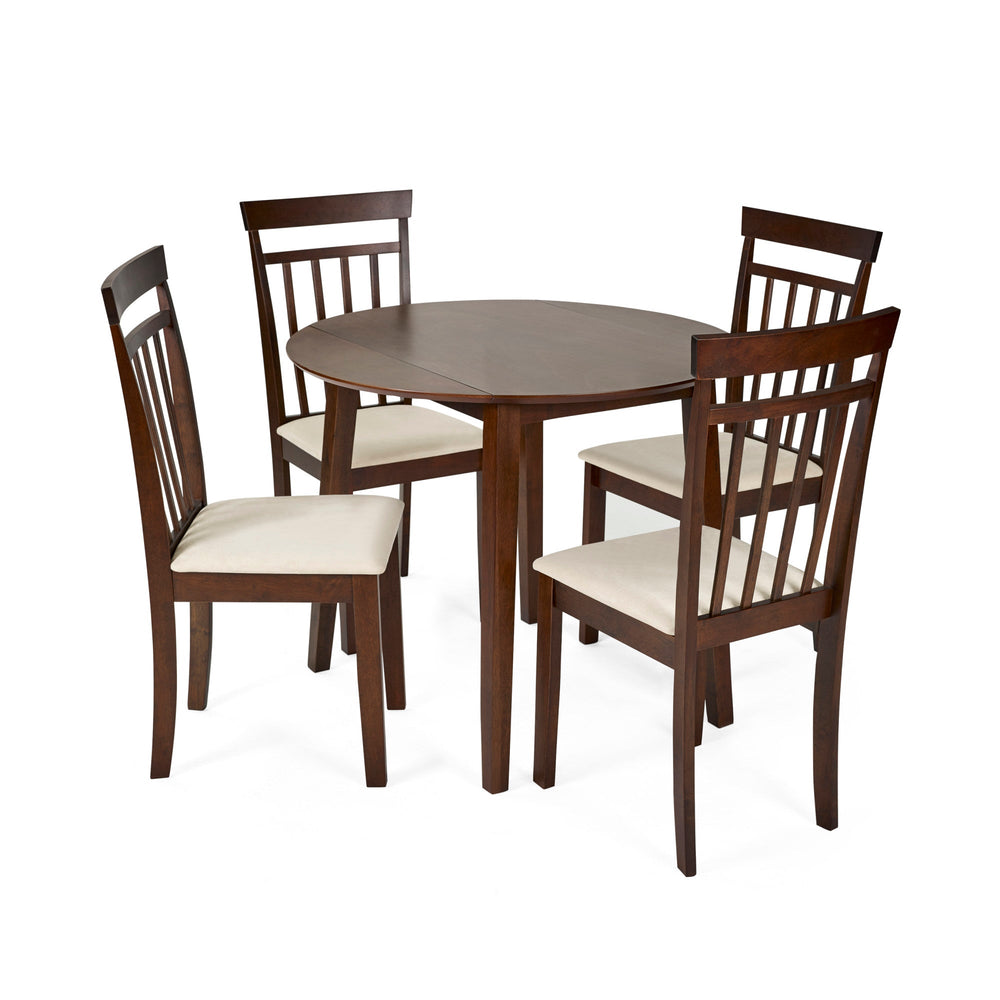 Set of two dark wood dining chairs with beige cushions alongside small round dining table on white background