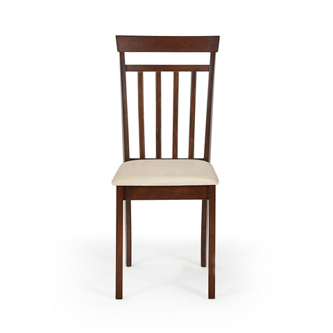 Close-up of beige cushioned seat on brown wooden dining chair with wood grain floor background
