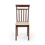 Close-up of beige cushioned seat on brown wooden dining chair with wood grain floor background
