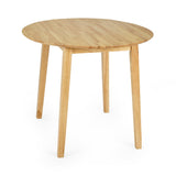 Round natural wood dropleaf table with four legs angled outward on white background