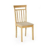 Single wooden dining chair with vertical slat back and beige cushioned seat, angled right