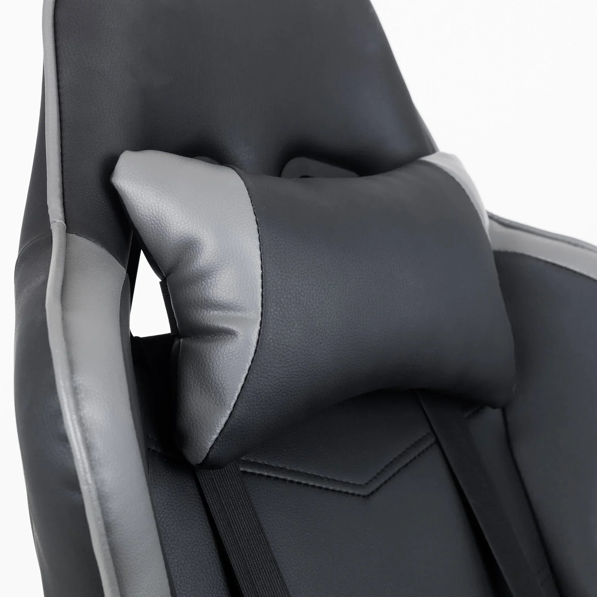 Comet gaming chair close-up showing grey and black padded headrest cushion