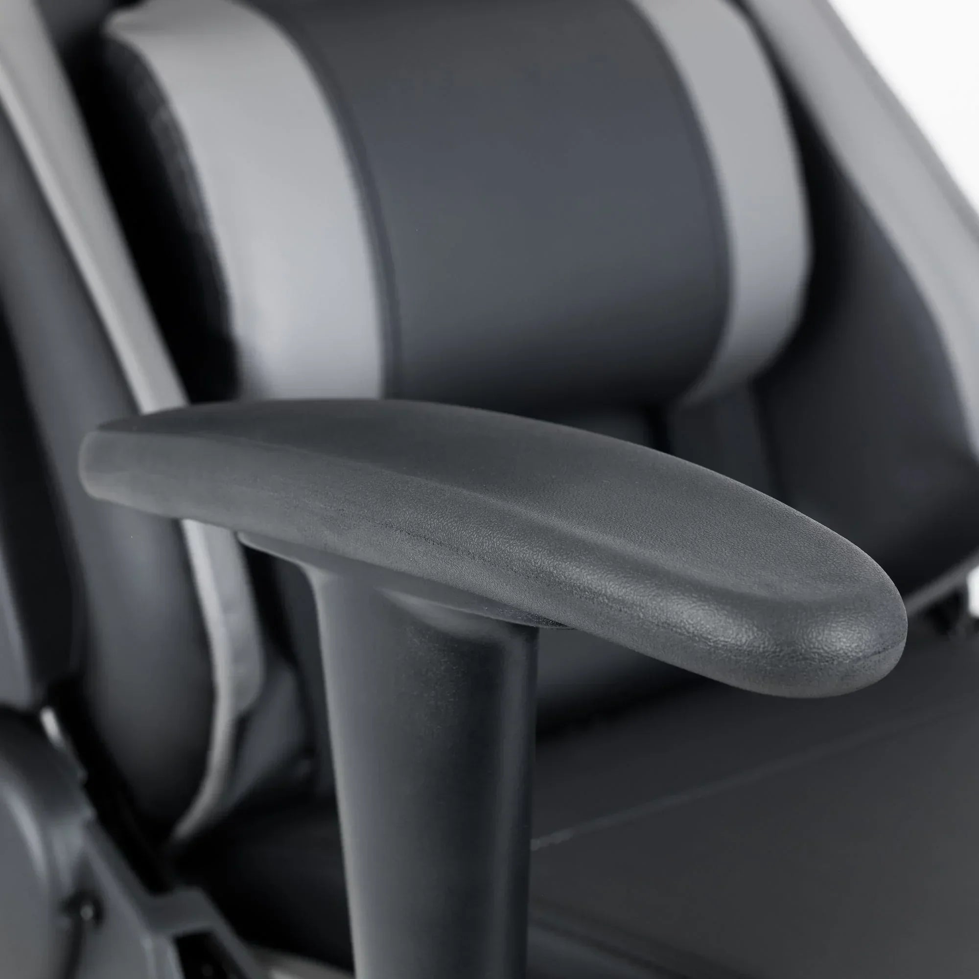 Comet gaming chair black adjustable armrest closeup with grey and black padded seat